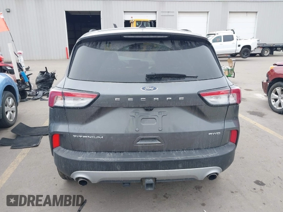 2021 Ford Escape Titanium with VIN 1FMCU9J92MUA27097, listed as a IAAI auction lot 41542774 with 14,822 mi miles and . Bid and sale history available at carsss.com. Image 17.