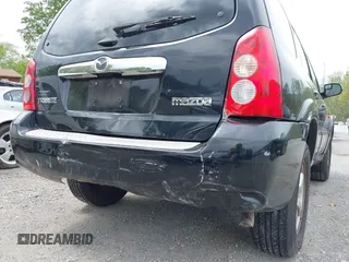 2005 Mazda Tribute S with VIN 4F2CZ96185KM16560, listed as a IAAI auction lot 42065748 with 84,584 mi miles and . Bid and sale history available at carsss.com. Image 12.