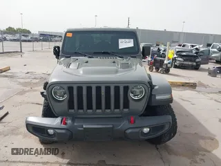 2020 Jeep Wrangler Unlimited Rubicon z VIN 1C4HJXFG2LW267154, wystawiony jako IAAI lot #41745497 z przebiegiem 28 692 mil mil oraz . Historia ofert i sprzedaży dostępna na DreamBid. Obrazek 13.