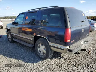1998 GMC Yukon with VIN 1GKEK13R6WJ706204, listed as a Copart auction lot 77577074 with 186,023 mi miles and Salvage Title. Bid and sale history available at carsss.com. Image 2.