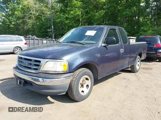 2000 Ford F-150 XL with VIN 1FTZX1723YNB00043, listed as a IAAI auction lot 42215601 with Not provided miles and . Bid and sale history available at DreamBid. Image 2.