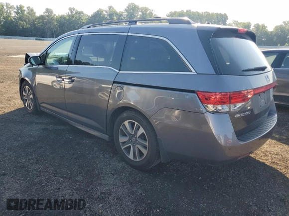 2014 Honda Odyssey Touring with VIN 5FNRL5H94EB116891, listed as a Copart auction lot 61400725 with 202,972 mi miles and Salvage title. Bid and sale history available at DreamBid. Image 2.