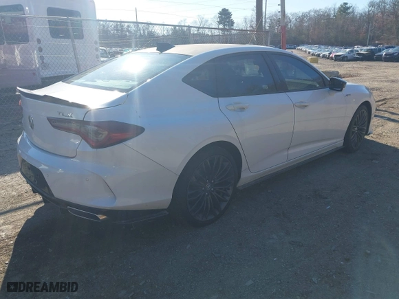 2022 Acura TLX w/A-Spec Package with VIN 19UUB5F52NA005022, listed as a IAAI auction lot 40977803 with 9,665 mi miles. Bid and sale history available at carsss.com. Image 4.