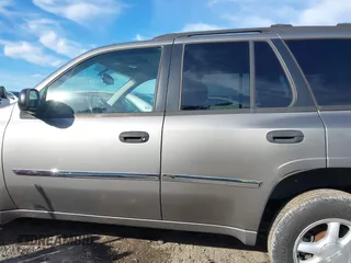2007 GMC Envoy SLE with VIN 1GKDS13S372241844, listed as a IAAI auction lot 41575443 with 144,726 mi miles. Bid and sale history available at carsss.com. Image 14.