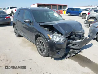 2016 Mazda CX-5 Grand Touring z VIN JM3KE4DY5G0837958, wystawiony jako IAAI lot #41713313 z przebiegiem Nie podano mil oraz . Historia ofert i sprzedaży dostępna na DreamBid. Obrazek 1.