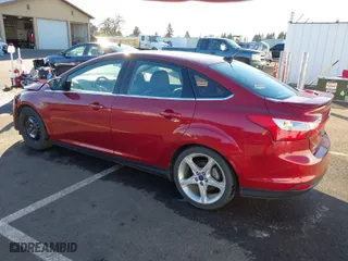 2014 Ford Focus Titanium with VIN 1FADP3J23EL137525, listed as a IAAI auction lot 41562684 with 127,104 mi miles. Bid and sale history available at carsss.com. Image 3.