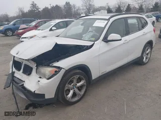 2013 BMW X1 xDrive35i with VIN WBAVM5C53DVV89288, listed as a IAAI auction lot 41609285 with 114,659 mi miles. Bid and sale history available at carsss.com. Image 2.