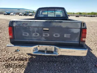 1990 Dodge Dakota z VIN 1B7FL23X7LS653679, wystawiony jako Copart lot #72073034 z przebiegiem 254 327 mil mil oraz Szkoda całkowita • Salvage title. Historia ofert i sprzedaży dostępna na DreamBid. Obrazek 6.