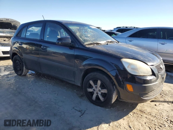 2009 Kia Rio LX with VIN KNADE243796516902, listed as a Copart auction lot 86567394 with 304,684 mi miles and Salvage Title. Bid and sale history available at carsss.com. Image 4.