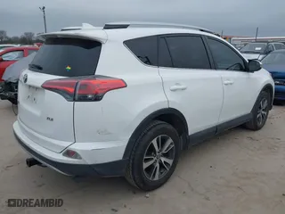 2016 Toyota RAV4 XLE with VIN 2T3WFREV8GW259777, listed as a IAAI auction lot 41241266 with 129,122 mi miles. Bid and sale history available at carsss.com. Image 4.