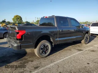 2023 Ford F-150 Lightning Pro with VIN 1FTVW1EL7PWG11261, listed as a Copart auction lot 64088925 with 3,288 mi miles and Salvage title. Bid and sale history available at DreamBid. Image 3.