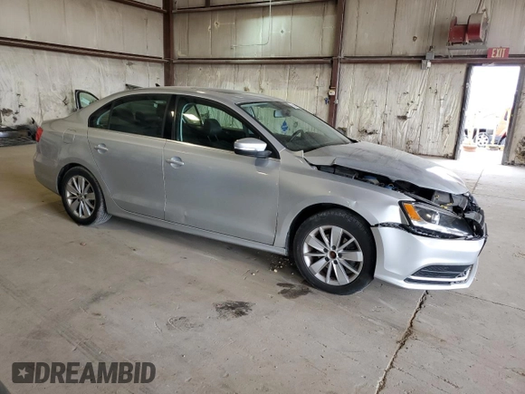 2015 Volkswagen Jetta SE with VIN 3VWD07AJ4FM404097, listed as a Copart auction lot 55054165 with 107,803 mi miles and Salvage title. Bid and sale history available at DreamBid. Image 4.