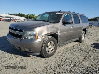 2014 Chevrolet Suburban LT with VIN 1GNSKJE79ER194228, listed as a Copart auction lot 63344715 with 116,001 mi miles and Salvage title. Bid and sale history available at DreamBid. Image 1.
