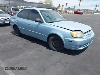 2005 Hyundai Accent GLS z VIN KMHCG45C85U591452, wystawiony jako IAAI lot #42114303 z przebiegiem 173 832 mil mil oraz . Historia ofert i sprzedaży dostępna na DreamBid. Obrazek 1.