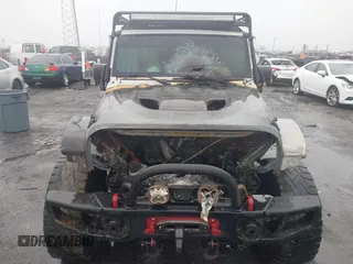 2016 Jeep Wrangler Unlimited Rubicon with VIN 1C4BJWFGXGL185227, listed as a IAAI auction lot 41555159 with 1 mi miles. Bid and sale history available at carsss.com. Image 14.