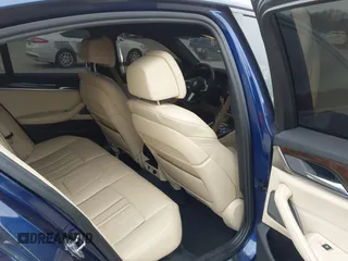 2018 BMW 5 Series M550i xDrive with VIN WBAJB9C56JG463891, listed as a IAAI auction lot 41731556 with 104,860 mi miles. Bid and sale history available at carsss.com. Image 8.