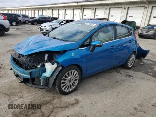 2015 Ford Fiesta Titanium z VIN 3FADP4FJ7FM120958, wystawiony jako Copart lot #85260204 z przebiegiem 144 587 mil mil oraz Szkoda całkowita • Salvage title. Historia ofert i sprzedaży dostępna na DreamBid. Obrazek 1.