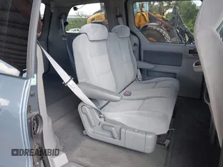 2004 Ford Freestar SES z VIN 2FMZA576X4BA05461, wystawiony jako IAAI lot #42255432 z przebiegiem 115 971 mil mil oraz . Historia ofert i sprzedaży dostępna na DreamBid. Obrazek 8.