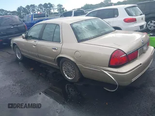 1999 Mercury Grand Marquis GS z VIN 2MEFM74W4XX645430, wystawiony jako IAAI lot #42154522 z przebiegiem 152 306 mil mil oraz . Historia ofert i sprzedaży dostępna na DreamBid. Obrazek 3.