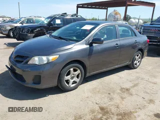 2012 Toyota Corolla L with VIN 5YFBU4EEXCP054988, listed as a IAAI auction lot 41973361 with 193,390 mi miles. Bid and sale history available at carsss.com. Image 2.