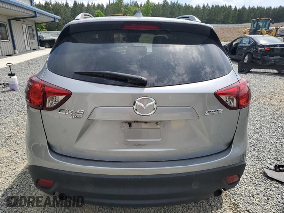 2014 Mazda CX-5 Grand Touring with VIN JM3KE4DY9E0416967, listed as a Copart auction lot 54215285 with 77,296 mi miles and Salvage Title. Bid and sale history available at DreamBid. Image 6.