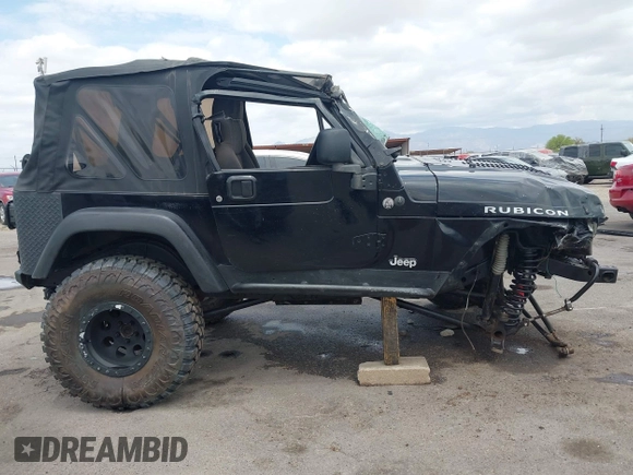 2004 Jeep Wrangler Rubicon z VIN 1J4FA69S84P727716, wystawiony jako IAAI lot #42162129 z przebiegiem 90 844 mil mil oraz . Historia ofert i sprzedaży dostępna na DreamBid. Obrazek 14.