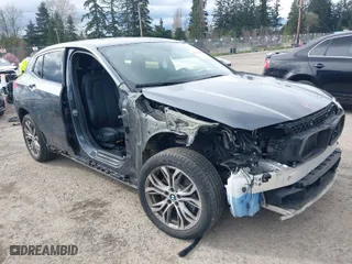 2018 BMW X2 xDrive28i with VIN WBXYJ5C38JEF73158, listed as a IAAI auction lot 41933007 with NaN miles. Bid and sale history available at carsss.com. Image 1.