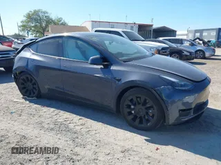 2023 Tesla Model Y Long Range with VIN 7SAYGDEE1PA203937, listed as a IAAI auction lot 41814421 with 9,138 mi miles. Bid and sale history available at carsss.com. Image 1.