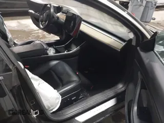 2018 Tesla Model 3 Long Range Battery with VIN 5YJ3E1EB7JF086778, listed as a IAAI auction lot 41348008 with 74,491 mi miles and . Bid and sale history available at DreamBid. Image 5.