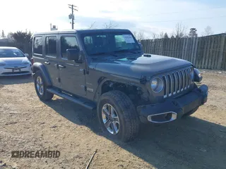 2018 Jeep Wrangler Unlimited Sahara z VIN 1C4HJXEN9JW303094, wystawiony jako IAAI lot #41491564 z przebiegiem 66 128 mil mil oraz . Historia ofert i sprzedaży dostępna na DreamBid. Obrazek 1.