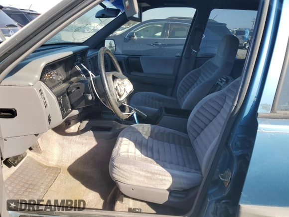 1994 Jeep Grand Cherokee Laredo with VIN 1J4FX58S1RC334178, listed as a Copart auction lot 75943554 with 165,435 mi miles and Clean Title. Bid and sale history available at carsss.com. Image 7.