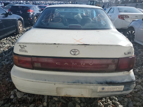 1994 Toyota Camry LE with VIN 4T1SK12E4RU396095, listed as a Copart auction lot 42987105 with 289,218 mi miles and Salvage Title. Bid and sale history available at carsss.com. Image 6.
