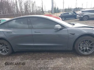 2023 Tesla Model 3 with VIN 5YJ3E1EAXPF693693, listed as a IAAI auction lot 41709704 with 12,473 mi miles and . Bid and sale history available at DreamBid. Image 13.