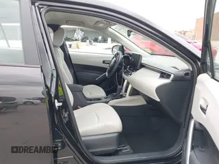 2024 Toyota Corolla Cross L with VIN 7MUAAABG0RV084192, listed as a IAAI auction lot 42137440 with 18,034 mi miles and . Bid and sale history available at DreamBid. Image 5.