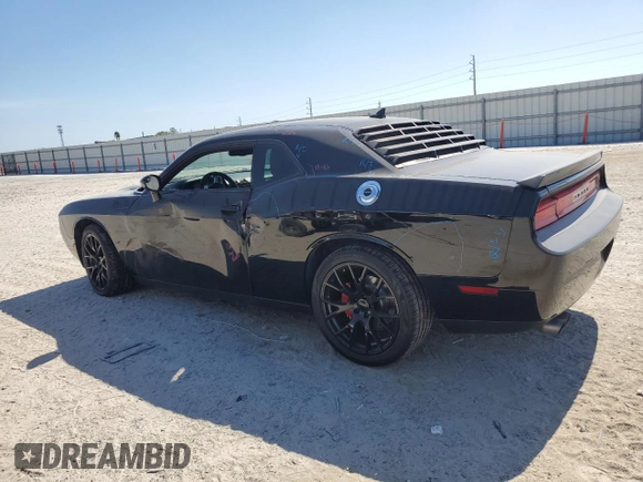 2014 Dodge Challenger R/T z VIN 2C3CDYBT6EH112199, wystawiony jako Copart lot #58023535 z przebiegiem 99 977 mil mil oraz Szkody całkowita. Historia ofert i sprzedaży dostępna na DreamBid. Obrazek 2.