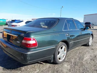 2000 Infiniti Q45 with VIN JNKBY31A7YM301457, listed as a IAAI auction lot 41583825 with 174,265 mi miles. Bid and sale history available at carsss.com. Image 6.