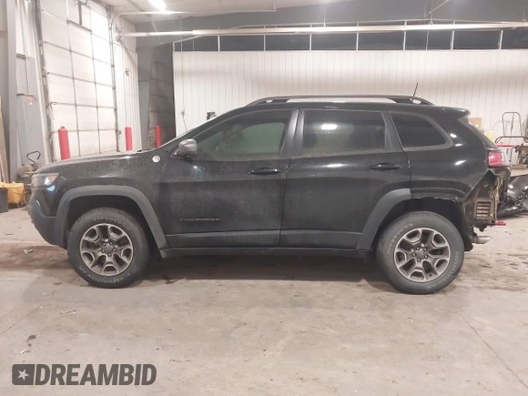 2020 Jeep Cherokee Trailhawk z VIN 1C4PJMBX4LD507364, wystawiony jako IAAI lot #41202333 z przebiegiem 90 000 mil mil oraz . Historia ofert i sprzedaży dostępna na DreamBid. Obrazek 14.