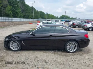 2014 BMW 4 Series 435i with VIN WBA3T3C50EJ876997, listed as a IAAI auction lot 42406299 with 115,048 mi miles and . Bid and sale history available at DreamBid. Image 14.