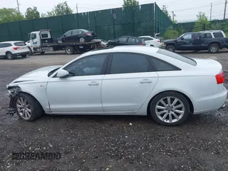 2014 Audi A6 Premium Plus z VIN WAUFGAFC4EN081900, wystawiony jako IAAI lot #42268150 z przebiegiem 150 238 mil mil oraz . Historia ofert i sprzedaży dostępna na DreamBid. Obrazek 14.