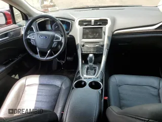 2013 Ford Fusion SE Hybrid z VIN 3FA6P0LUXDR335590, wystawiony jako Copart lot #60541395 z przebiegiem 121 975 mil mil oraz Szkoda całkowita • Salvage title. Historia ofert i sprzedaży dostępna na DreamBid. Obrazek 8.