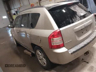 2010 Jeep Compass Sport with VIN 1J4NF4FB7AD501587, listed as a IAAI auction lot 41514419 with 154,826 mi miles. Bid and sale history available at carsss.com. Image 3.