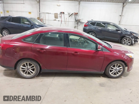 2015 Ford Focus SE with VIN 1FADP3F21FL270827, listed as a IAAI auction lot 42665015 with 162,745 mi miles and . Bid and sale history available at DreamBid. Image 14.