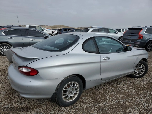 1999 Hyundai Tiburon with VIN KMHJG24F8XU126762, listed as a Copart auction lot 88747725 with 51,296 mi miles and Salvage Title. Bid and sale history available at carsss.com. Image 3.
