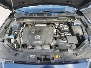 2018 Mazda CX-5 Grand Touring with VIN JM3KFADMXJ1353942, listed as a Copart auction lot 60570835 with 74,400 mi miles and Clean title. Bid and sale history available at DreamBid. Image 12.