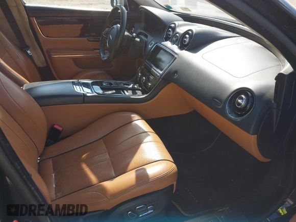 2013 Jaguar XJ Portfolio with VIN SAJWJ2GDXD8V55879, listed as a IAAI auction lot 41568366 with 121,119 mi miles and . Bid and sale history available at DreamBid. Image 5.