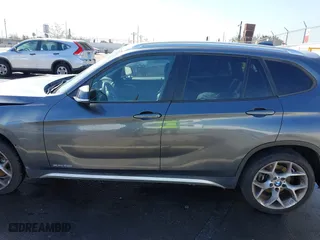 2014 BMW X1 xDrive28i with VIN WBAVL1C57EVY23722, listed as a IAAI auction lot 41839543 with 121,742 mi miles. Bid and sale history available at carsss.com. Image 15.