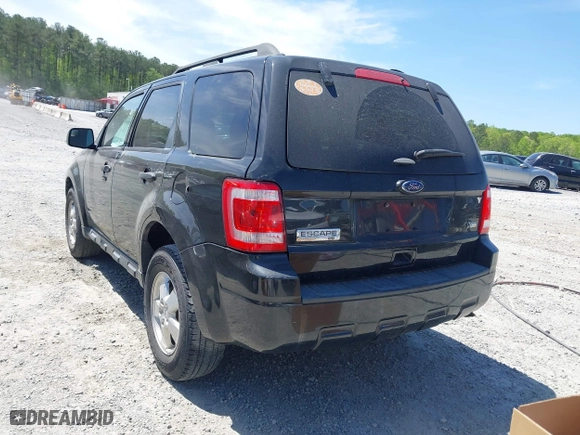 2011 Ford Escape XLT with VIN 1FMCU9DG5BKC36529, listed as a IAAI auction lot 42045682 with 141,101 mi miles. Bid and sale history available at carsss.com. Image 3.