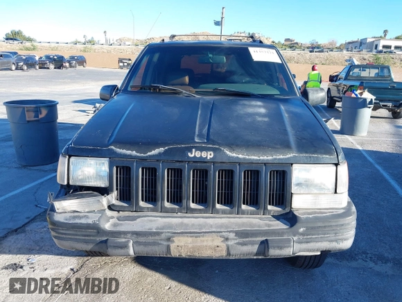 1998 Jeep Grand Cherokee Limited with VIN 1J4GX78Y8WC110325, listed as a IAAI auction lot 41357373 with 165,106 mi miles. Bid and sale history available at carsss.com. Image 12.