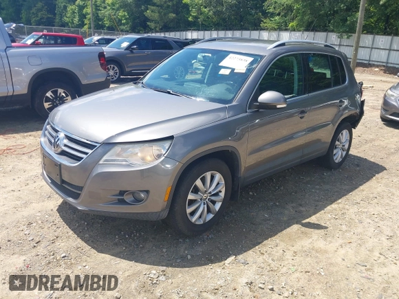 2011 Volkswagen Tiguan SEL z VIN WVGBV7AX5BW512203, wystawiony jako IAAI lot #42273838 z przebiegiem 157 072 mil mil oraz . Historia ofert i sprzedaży dostępna na DreamBid. Obrazek 17.