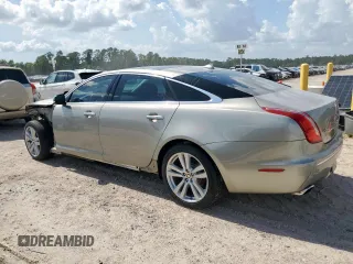 2013 Jaguar XJ Portfolio with VIN SAJWJ2GD5D8V49505, listed as a Copart auction lot 61171955 with 129,158 mi miles and Salvage title. Bid and sale history available at DreamBid. Image 2.